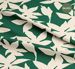 Digitally Printed Fabric with Leaf Silhouette Pattern on a Green Background
